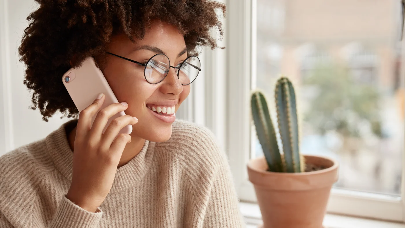 Communicative Asphalt Roofing - San Antonio - Lynx Roofing A happy woman on the phone