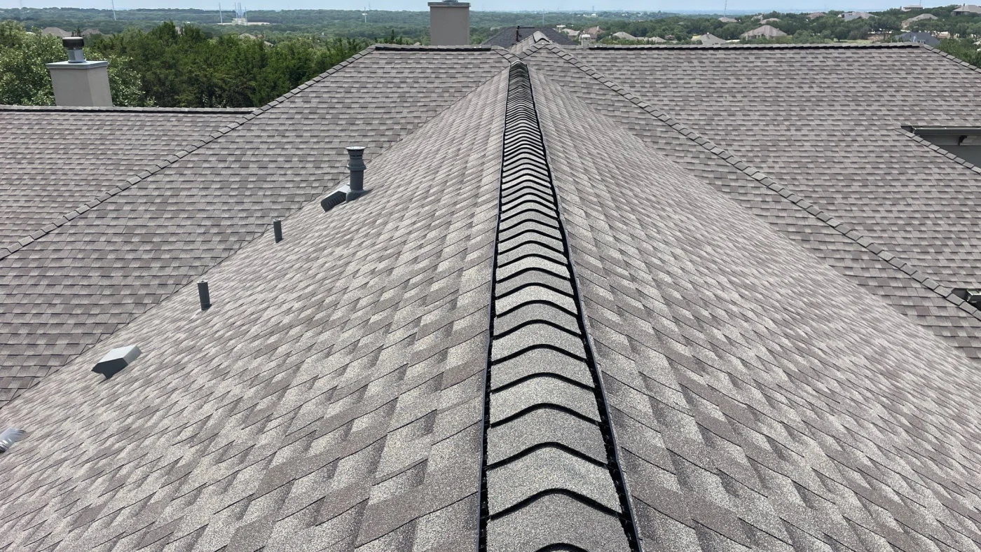 Closeup of a ridge vent on an expansive shingle roof