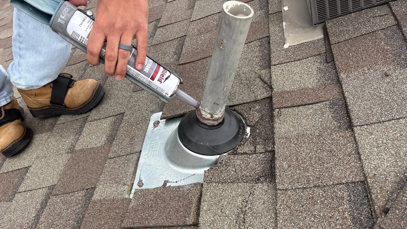 Detailed Asphalt Roofing - San Antonio - Lynx Roofing A Lynx Roofing contractor repairs a vent