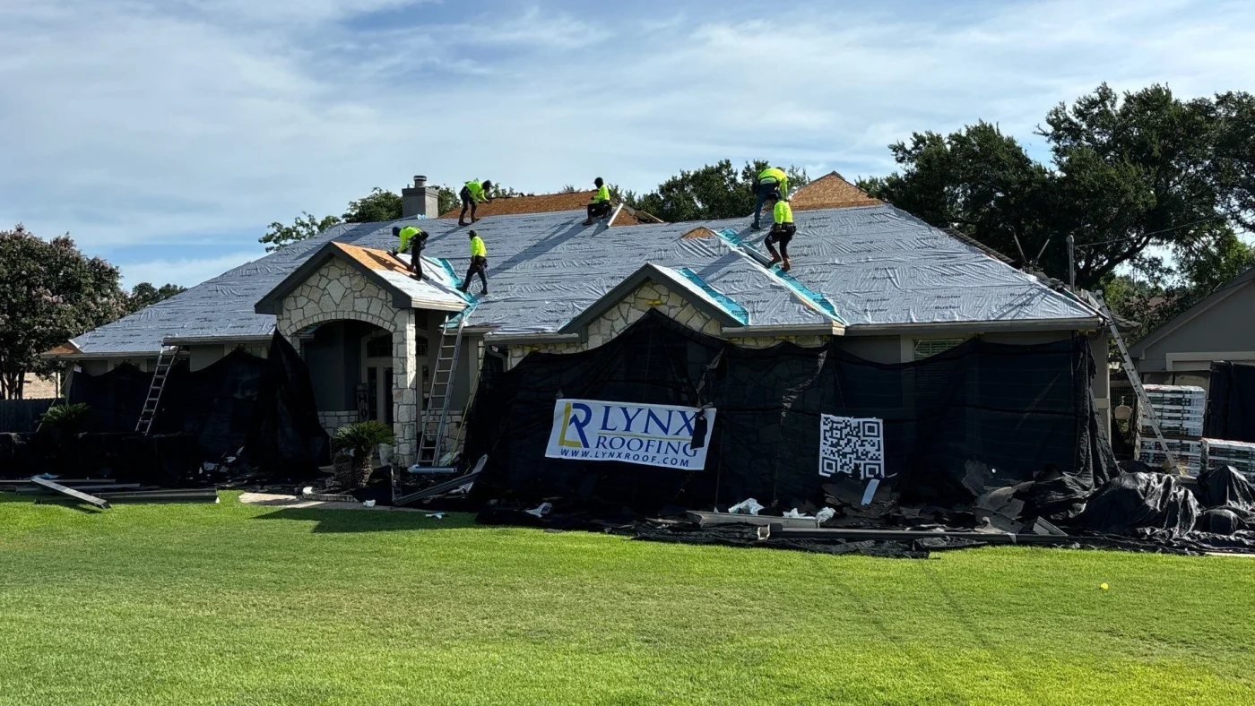 A roof replacement in progress with a Catch-All in use