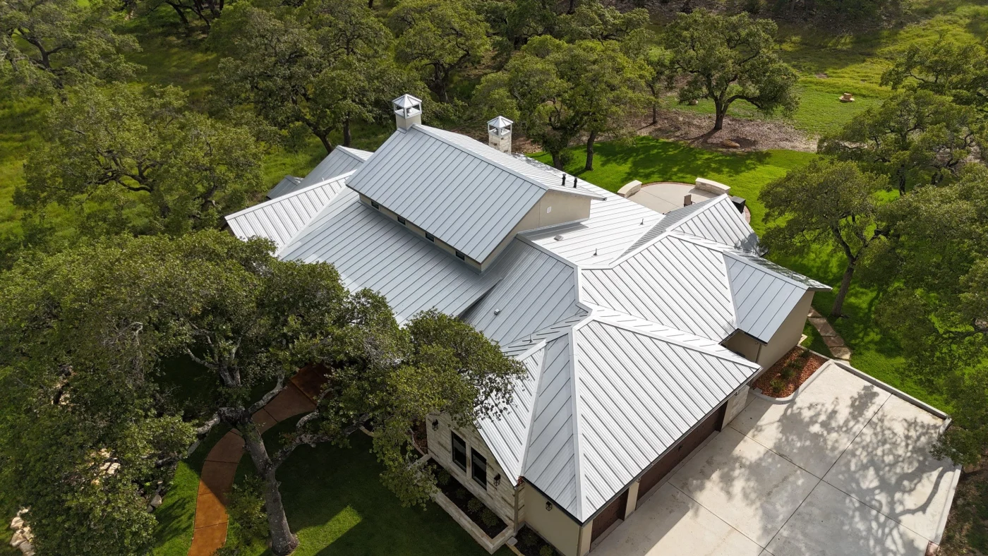 Drone view of an expansive gray metal roof