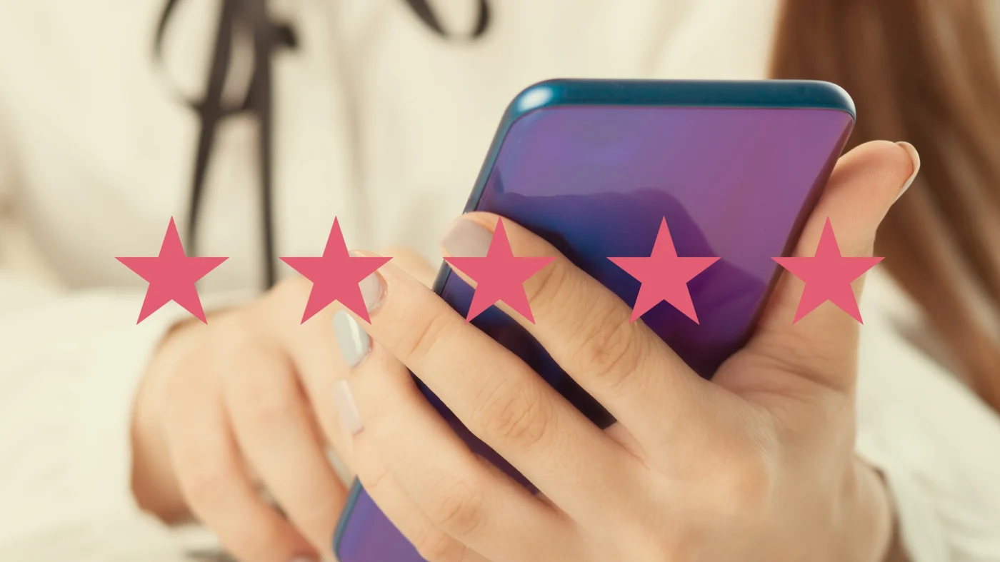 A person holds up their purple phone while leaving a review with 5 stars overlaying the image