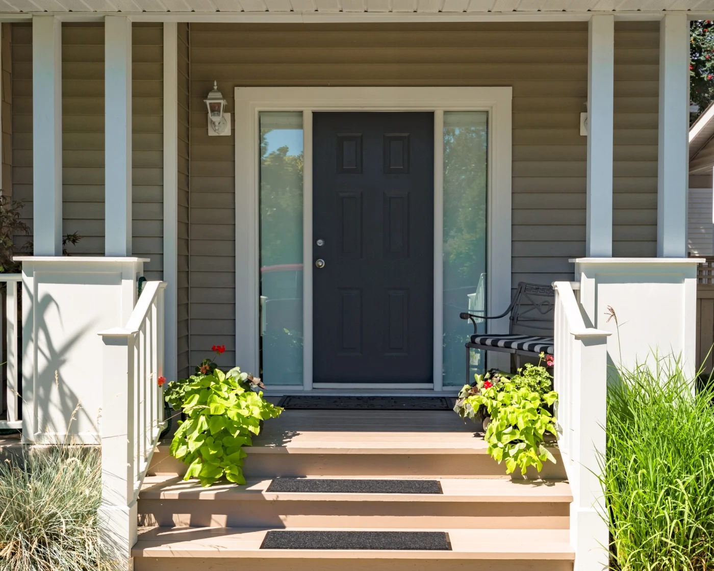 Amazing Door Installation In San Antonio, TX | Lynx Roofing A new dark door with sidelights installed on a San Antonio, TX home.
